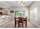 Inviting dining area featuring a wooden table set and a view to the outdoor space at 3041 E Fremont Rd, Phoenix, AZ 85042