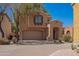 Charming two-story home with an attached two-car garage and covered entryway at 3041 E Fremont Rd, Phoenix, AZ 85042