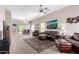 Spacious living room with plush leather furniture, a decorative rug, and ample natural light at 3041 E Fremont Rd, Phoenix, AZ 85042