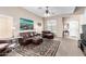 Spacious living room with plush leather furniture, a decorative rug, and ample natural light at 3041 E Fremont Rd, Phoenix, AZ 85042