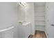 Well-lit bathroom equipped with a vanity, toilet, and built-in storage shelves at 320 E Mckellips Rd # 46, Mesa, AZ 85201