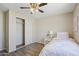 Bedroom with a ceiling fan, closet with sliding doors and decorated with a pink theme at 320 E Mckellips Rd # 46, Mesa, AZ 85201