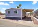 Inviting home featuring a covered carport and a neatly landscaped yard at 320 E Mckellips Rd # 46, Mesa, AZ 85201