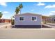 Charming single-story home with well-maintained exterior and a neatly kept yard at 320 E Mckellips Rd # 46, Mesa, AZ 85201