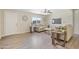 Bright living room featuring modern ceiling fan and neutral furniture, creating a welcoming atmosphere at 320 E Mckellips Rd # 46, Mesa, AZ 85201