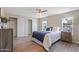 Cozy bedroom features a large closet, wood-look floors and plenty of natural light at 320 E Mckellips Rd # 46, Mesa, AZ 85201