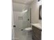 Bright bathroom with white subway tile shower and new wooden vanity at 33220 N 60Th Way, Scottsdale, AZ 85266
