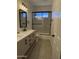 Modern bathroom with double vanity and glass shower doors at 33220 N 60Th Way, Scottsdale, AZ 85266