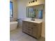 Bathroom featuring a large soaking tub, single vanity, and tiled floors at 33220 N 60Th Way, Scottsdale, AZ 85266