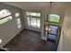 Sun-filled foyer features wood floors, a decorative chandelier, and large windows with neighborhood views at 33220 N 60Th Way, Scottsdale, AZ 85266