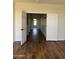 Long hallway with wood flooring and white trim at 33220 N 60Th Way, Scottsdale, AZ 85266