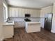 Bright, modern kitchen with white cabinets, stainless steel appliances and a kitchen island at 33220 N 60Th Way, Scottsdale, AZ 85266