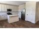 Modern kitchen featuring white cabinets, stainless steel appliances, white backsplash, and a kitchen island at 33220 N 60Th Way, Scottsdale, AZ 85266