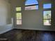 Bright, airy living room featuring a vaulted ceiling and several windows that bring the outdoors in at 33220 N 60Th Way, Scottsdale, AZ 85266