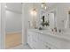 Bright bathroom with double sinks, white cabinetry, and elegant gold fixtures at 3825 E Coolidge St, Phoenix, AZ 85018