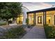 Stunning front exterior with black and white accents, landscaped front yard, and fire feature at 3825 E Coolidge St, Phoenix, AZ 85018