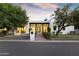 Charming single-Gathering home with manicured lawn and modern architectural details at 3825 E Coolidge St, Phoenix, AZ 85018