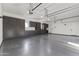 Spacious garage with sleek grey cabinetry and ample storage space at 3825 E Coolidge St, Phoenix, AZ 85018