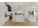 Spacious kitchen with large island, stainless steel appliances, and modern fixtures at 3825 E Coolidge St, Phoenix, AZ 85018