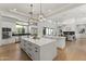 Open-concept kitchen featuring double islands, stainless appliances, and modern lighting at 3825 E Coolidge St, Phoenix, AZ 85018