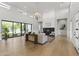 Bright open-concept living room with high ceilings, fireplace, and large windows at 3825 E Coolidge St, Phoenix, AZ 85018