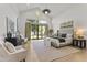 Bright bedroom boasts vaulted ceilings, seating area, and a large window overlooking the landscaped backyard at 3825 E Coolidge St, Phoenix, AZ 85018