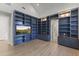 Well-appointed office featuring custom built-in shelving and an en-suite bathroom at 3825 E Coolidge St, Phoenix, AZ 85018