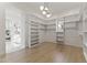 Spacious walk-in closet with custom shelving and lots of room for clothing, shoes, and storage at 3825 E Coolidge St, Phoenix, AZ 85018