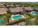 Backyard oasis features a sparkling pool, covered patio, and beautifully landscaped yard at 4010 E Hamblin Dr, Phoenix, AZ 85050