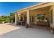 Spacious backyard patio with outdoor dining set and landscaping around pool area at 4010 E Hamblin Dr, Phoenix, AZ 85050