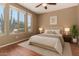 Bright bedroom with hardwood floors, and large windows at 4010 E Hamblin Dr, Phoenix, AZ 85050