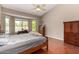 Bright bedroom with vaulted ceilings, a ceiling fan, a large bay window, and hardwood floors at 4010 E Hamblin Dr, Phoenix, AZ 85050