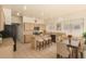 Well-lit kitchen featuring an island with seating, ample cabinet space, and stainless steel appliances at 4010 E Hamblin Dr, Phoenix, AZ 85050