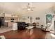 Open concept living room showcases kitchen with fireplace, and hardwood floors at 4010 E Hamblin Dr, Phoenix, AZ 85050