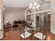 Dining room features hardwood floor, chandelier, and access to other living areas at 4010 E Hamblin Dr, Phoenix, AZ 85050