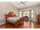 Primary bedroom with hardwood floors, large bay window overlooking the pool, and vaulted ceiling at 4010 E Hamblin Dr, Phoenix, AZ 85050