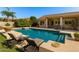 Backyard swimming pool with lounge chairs and desert landscaping, perfect for relaxation at 4010 E Hamblin Dr, Phoenix, AZ 85050