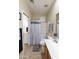 Bathroom with tile flooring, shower/tub combo, and neutral paint at 4202 E Broadway Rd # 223, Mesa, AZ 85206
