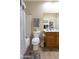 Bathroom includes a tub, toilet, and oak vanity with white sink at 4202 E Broadway Rd # 223, Mesa, AZ 85206