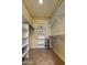 Organized walk-in closet featuring built-in shelving and rods at 4202 E Broadway Rd # 223, Mesa, AZ 85206