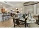 Dining area features elegant table setting, open to living spaces, with tiled floors and natural light at 4202 E Broadway Rd # 223, Mesa, AZ 85206