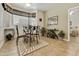 Charming dining room with a chandelier, a mirror, plants, and decorative window treatments at 4202 E Broadway Rd # 223, Mesa, AZ 85206
