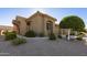 Home exterior with a neutral palette, a tile roof, low maintenance landscaping, and an attached garage at 4202 E Broadway Rd # 223, Mesa, AZ 85206