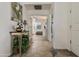 Bright hallway featuring tiled floors that lead to the bedroom, with views of the living spaces at 4202 E Broadway Rd # 223, Mesa, AZ 85206