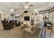 The living room offers built-in shelving and cabinets, a ceiling fan, and natural light at 4202 E Broadway Rd # 223, Mesa, AZ 85206