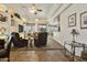 Spacious living room includes built-in shelving, a ceiling fan, and tile flooring at 4202 E Broadway Rd # 223, Mesa, AZ 85206