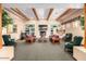 Cozy resident lounge with comfortable seating, fireplace, and built-in shelving at 4202 E Broadway Rd # 223, Mesa, AZ 85206