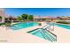 Resort-style pool and hot tub with poolside seating and lush landscaping at 4202 E Broadway Rd # 223, Mesa, AZ 85206