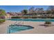 Community pool and hot tub with lounge chairs and manicured landscaping at 4202 E Broadway Rd # 223, Mesa, AZ 85206