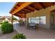Community poolside patio with barbeque, fireplace, covered area, and outdoor seating at 4202 E Broadway Rd # 223, Mesa, AZ 85206